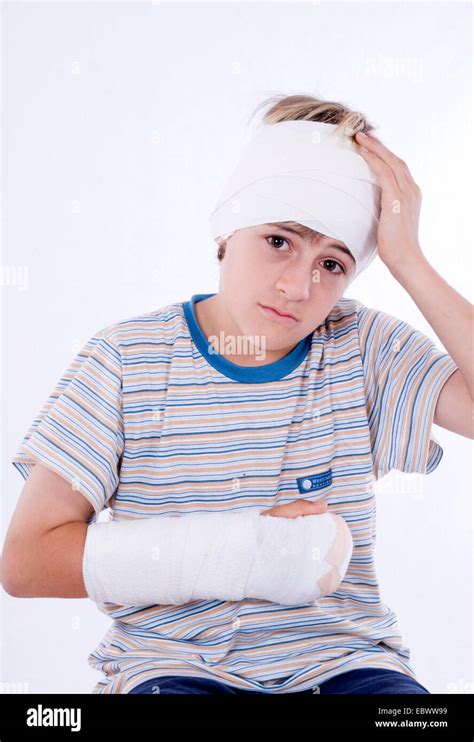 Boy With Arm In Plaster And Bandage On Head Stock Photo Royalty Free