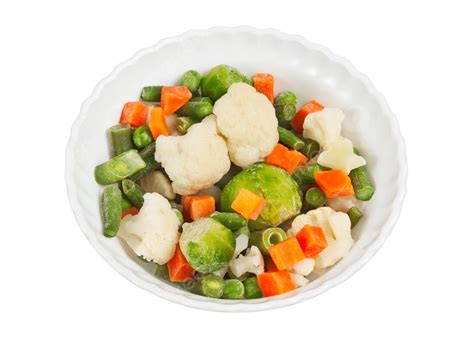 Finely Chopped Vegetables On A Plate Orange Color Sliced Background