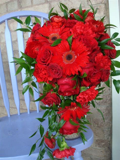 These two flowers make an enchanting wedding bouquet arrangement. gerbera daisies roses and spray roses | Gerbera wedding ...