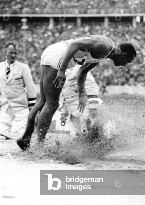 Summer Olympics 1936 Jesse Owens Usa In The Long Jump During The