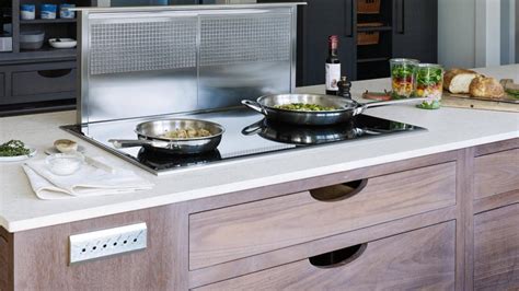 When cooking, the homeowner can pull out the range and vent out the kitchen, but during dining or casual food preparation, this range remains. Telescoping downdraft vent for the kitchen. | HGTV