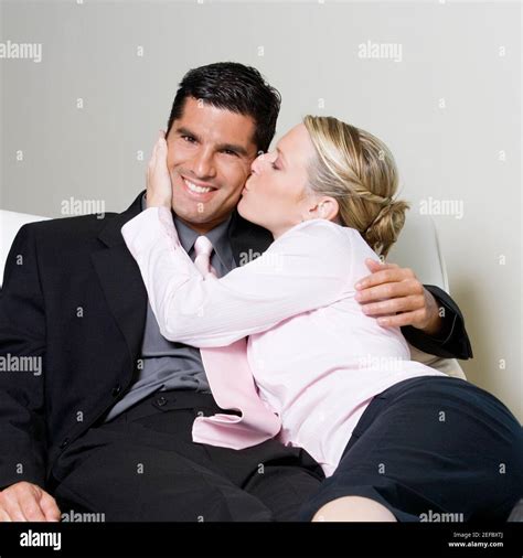 Businesswoman Kissing A Businessman Stock Photo Alamy