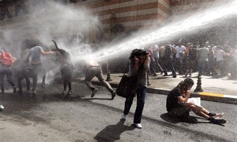 Turkish Riot Police Use Water Cannons To Disperse Demonstrators During