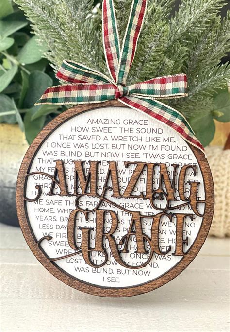 A Christmas Ornament With The Words Amazing Grace On It