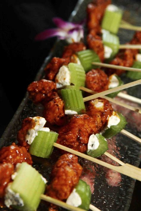 Skewered Meat And Vegetables On A Tray With Toothpicks In The Foreground