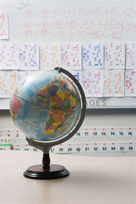 Globe On Desk In Elementary Classroom By Moodboard Vectors