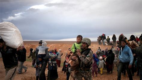 Syrian Refugees Flee To Safety In Jordan Walking Through The Remote