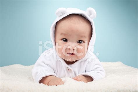 Cute Asian Baby Laying On Stomach Stock Photo Royalty Free Freeimages