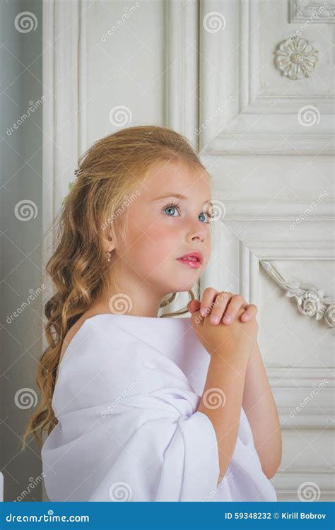 A Beautiful Little Girl Angel In White Robe Praying Stock Photo Image