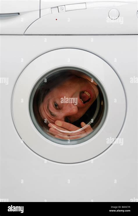 Washing Machine With A Man Trapped Inside Stock Photo Alamy