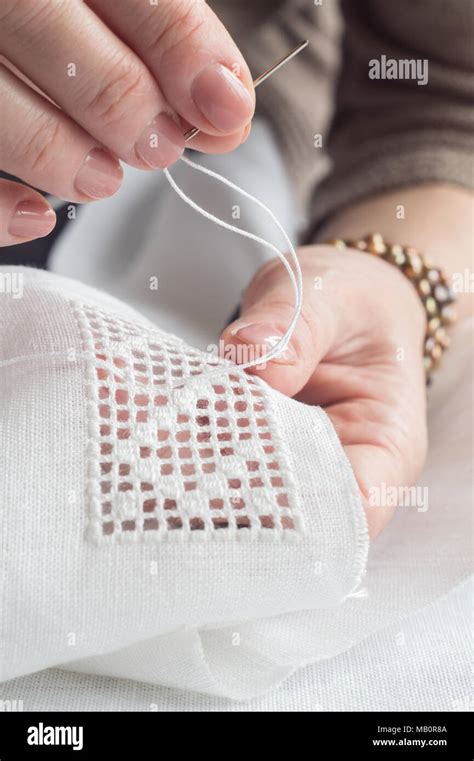 Hands Of A Woman Embroidering A Geometric Ornament Stock Photo Alamy