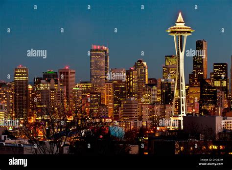 Seattle City Skyline At Night Highlighted By The Space Needle Seattle