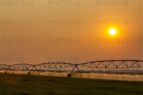 Irrigation Equipment In Field At Sunset Photo12 Tetra Images Steve Smith