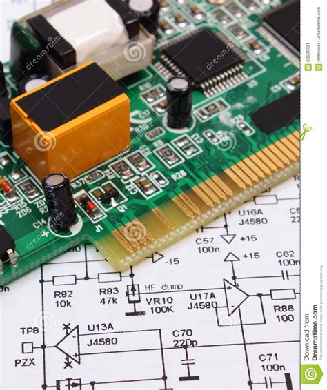Printed Circuit Board Lying On Diagram Of Electronics