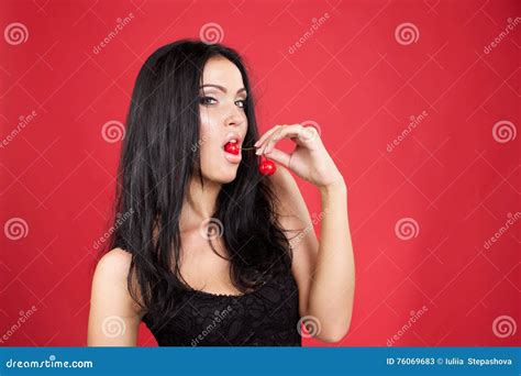 beautiful brunette woman with cherry stock image image of makeup natural 76069683