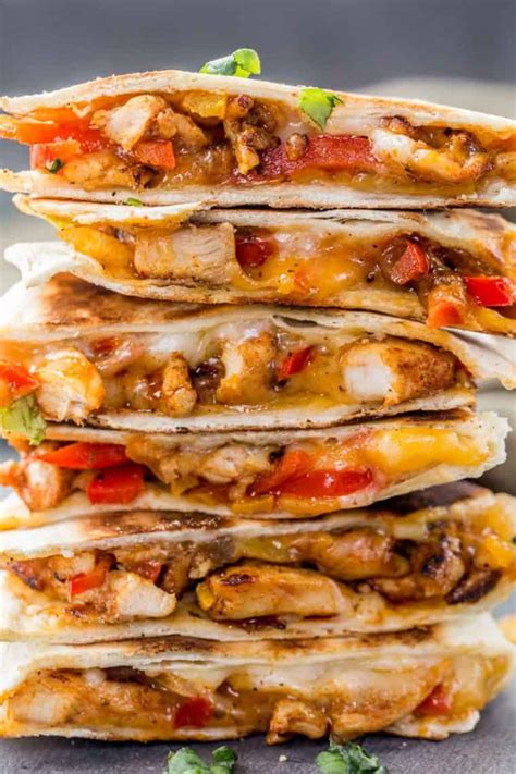 Ready in about 15 minutes, this is a cheesy chicken quesadilla that is spicy and so simple to make for a quick cozy weeknight dinner! Chicken Fajita Quesadilla Recipe - Valentina's Corner