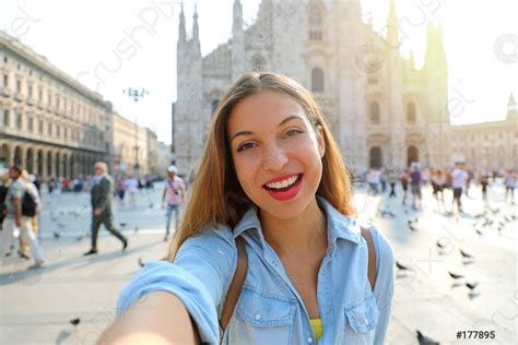 Happy Young Woman Take Selfie Photo In Front Of Milan Stock Photo