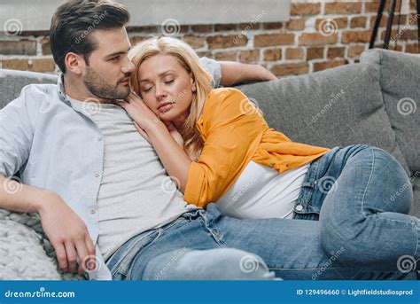 Couple Relaxing On Couch Stock Photo Image Of Couch 129496660