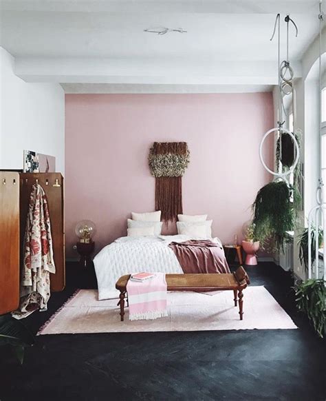 Dark Floors Pink Accent Wall Wood Tones And Neutral Accessories