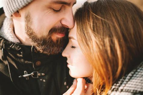 Close Up Portrait Of Hipster Couple Hugging With Closed Eyes Stock