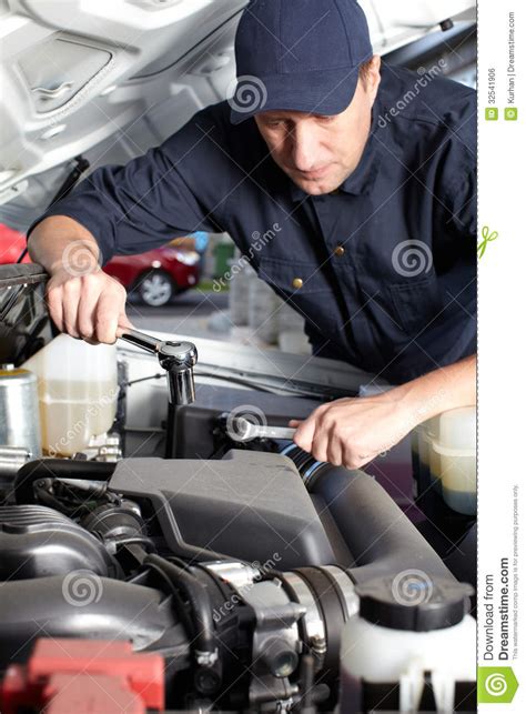 Name and save the file as a.jpg in your desired folder. Car Mechanic Working In Auto Repair Service. Stock Photo ...