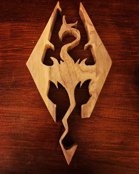 This cool enamel collector's pin features beautiful artwork of the skyrim's dragon iconic logo. Skyrim logo in scrap walnut : woodworking