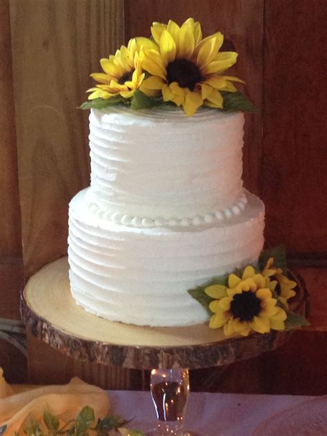 6 and 8 chocolate layer 2 tier wedding cake rustic iced in white buttercream sunflower accen