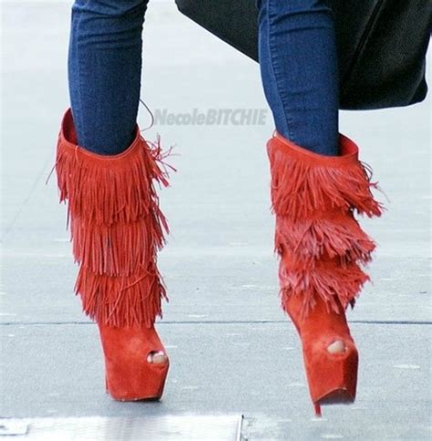 louboutins funkiest boots i have ever seen in my life and theyre coral fringe boots