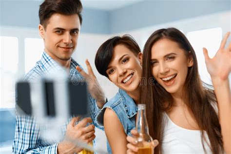 Celebration Friends Taking Selfie With Smartphone People Having Fun Friendship Stock Image
