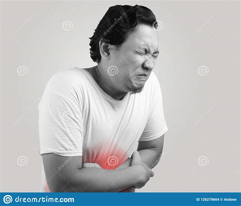 Young Man Having Stomach Ache Stock Photo - Image of indonesian 