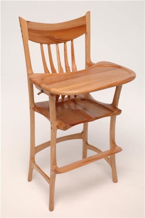 two sculpted high chairs