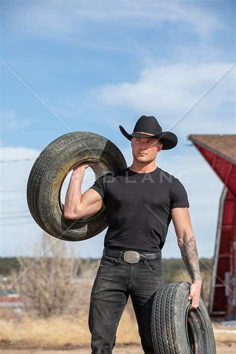 Cowboy Carrying Tires On A Ranch Rob Lang Images