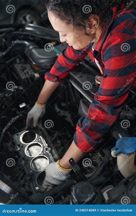 Female Auto Mechanic Working At Car Repair Service Station Stock Image