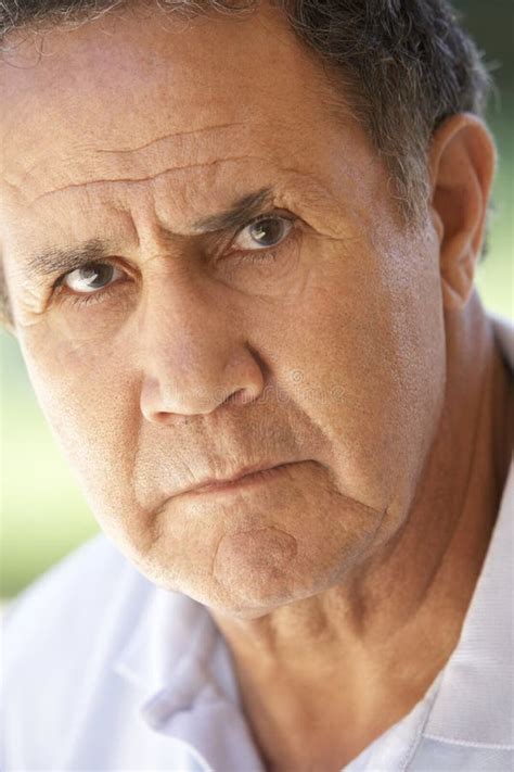 Portrait Of Senior Man Frowning At The Camera Stock Image Image Of