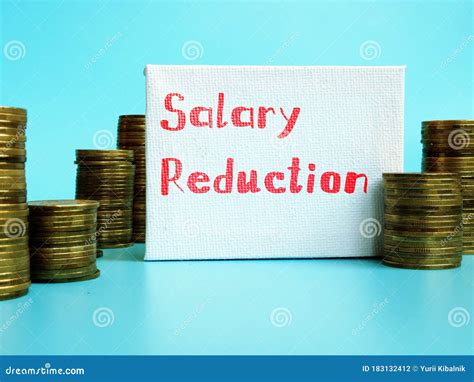 Business Concept Meaning Salary Reduction With Sign On The Piece Of