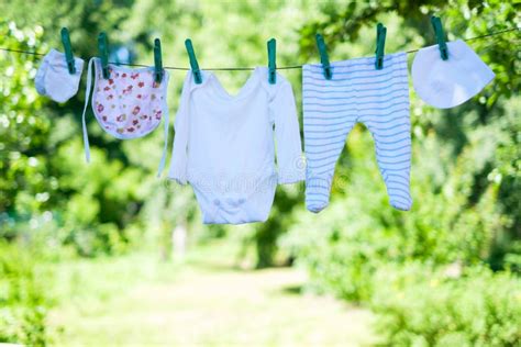 Baby Clothes On Clothesline In Garden Stock Image Image Of Cotton