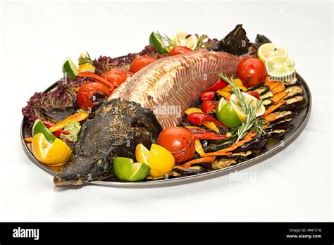 Royal Fish Sturgeon Entirely Bake On The Grill And Served With Roasted