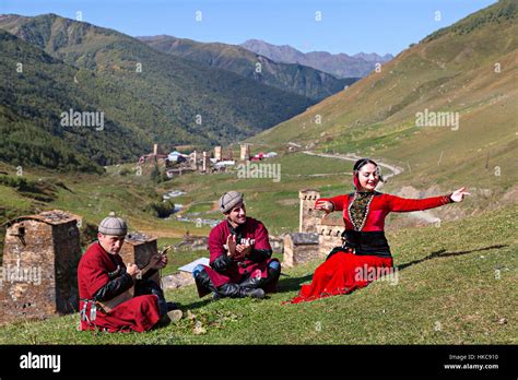 Georgian people in national costumes sing and dance in Ushguli Stock ...