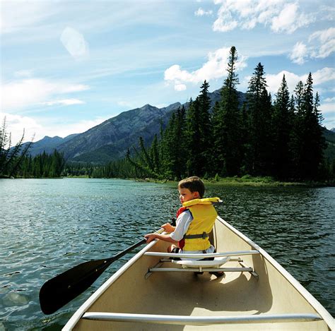 A Young Boy Explores The Bow River Photograph By Todd Korol Fine Art