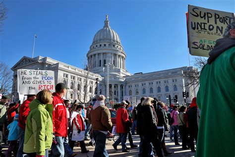 marching around the square protests in madison wi against… flickr