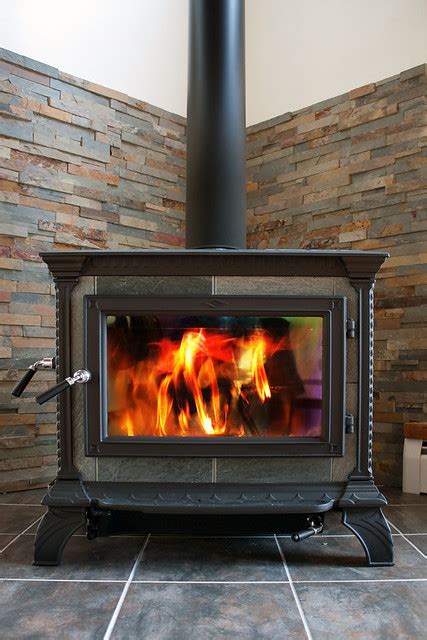 The nice speckled brown field tiles are all the same glaze, so the difference in appearance… Wood burning stove with cultured stone back and tile ...