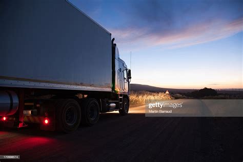 Semitruck Driving On Dirt Road High Res Stock Photo Getty Images