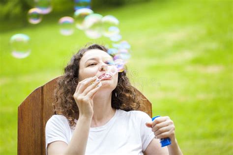 Young Woman Blowing Bubbles Stock Photo Image Of Summer Sunny 152470744