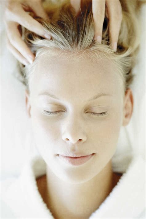 Woman Receiving Head Massage Stock Photo