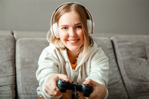 Premium Photo Beautiful Teen Girl Blonde Playing Video Console Game