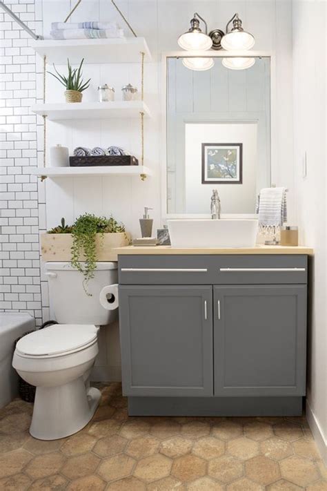 Here, a series of small open shelves provide storage, while a long mirror provides functionality. 35 Smart DIY Storage Ideas For Tiny Bathroom | HomeMydesign