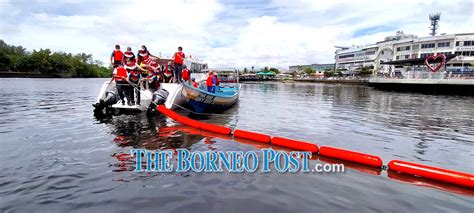 Two Floating Trash Barriers At Miri River