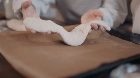 No Face Close Up Of Unrecognizable Female Hands Laying Raw Bread Dough