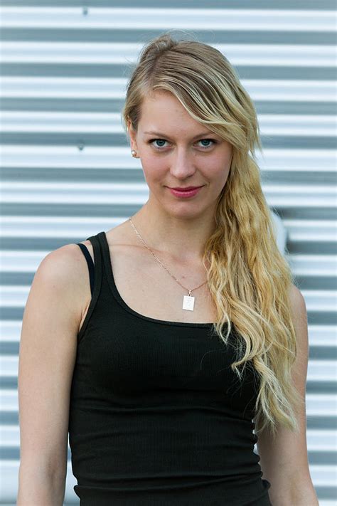 Portrait Of Young Beautiful Blonde Woman With Steel Background