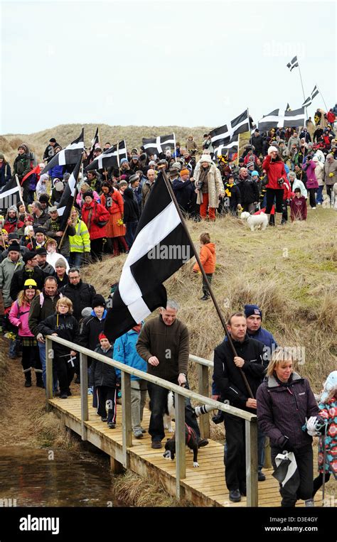 Cornish People Marching With The Flag Of Stpiran On Stpirans Day In